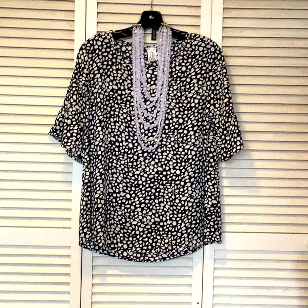 Now and forever woman’s black and white blouse